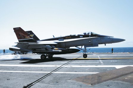 A F-18 strike jet lands back aboard the USS George H.W. Bush. Photo: US Navy.